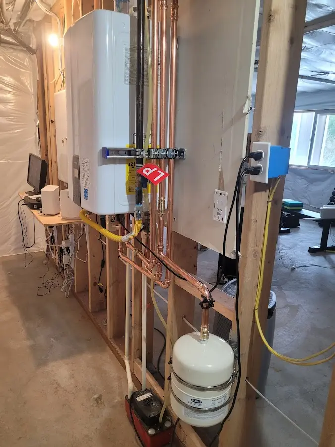 Licensed plumber repairing a kitchen sink in Greenwich
